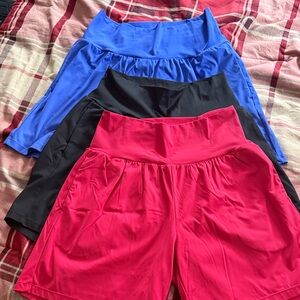 HALARA Athletic Shorts Trio in Blue, Black, and Pink